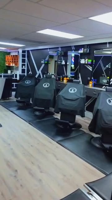 Barber chairs and mirrors inside the shop